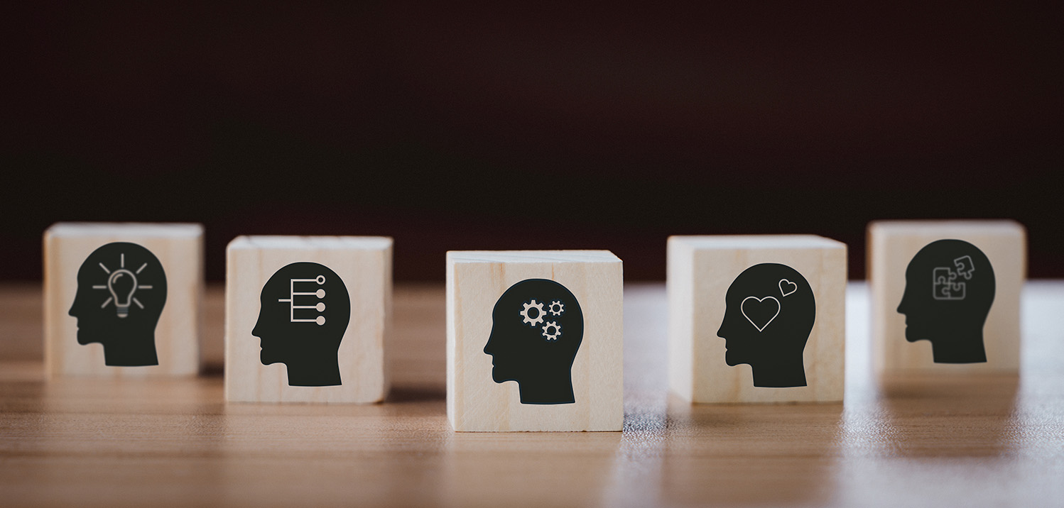 Staff competencies photo of blocks with silo heads with icons representing competencies